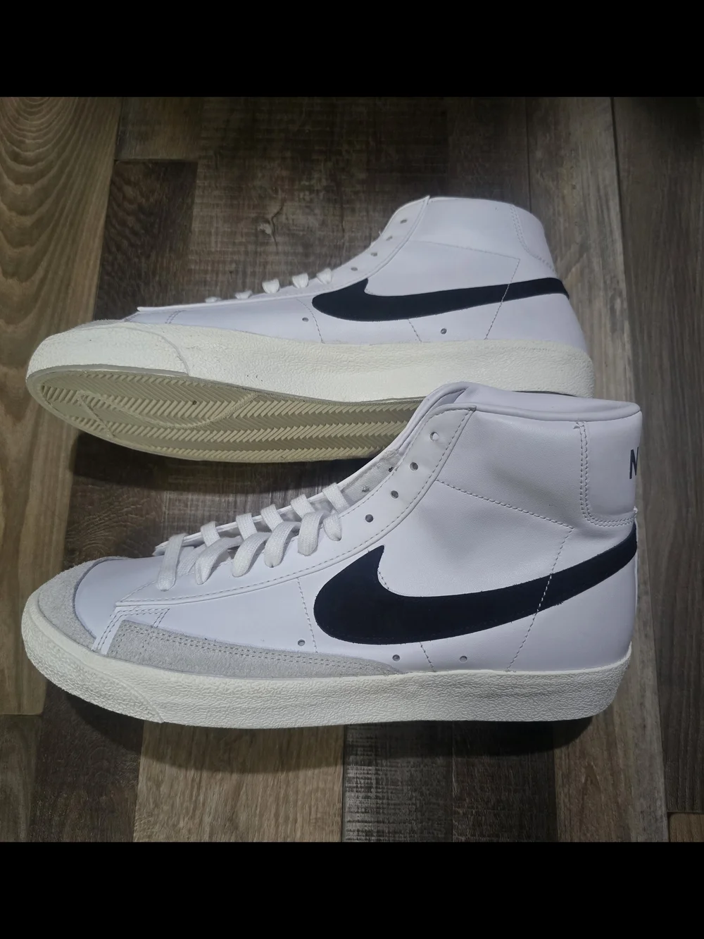 Nike Men’s White High-Top Sneakers with Black Swoosh